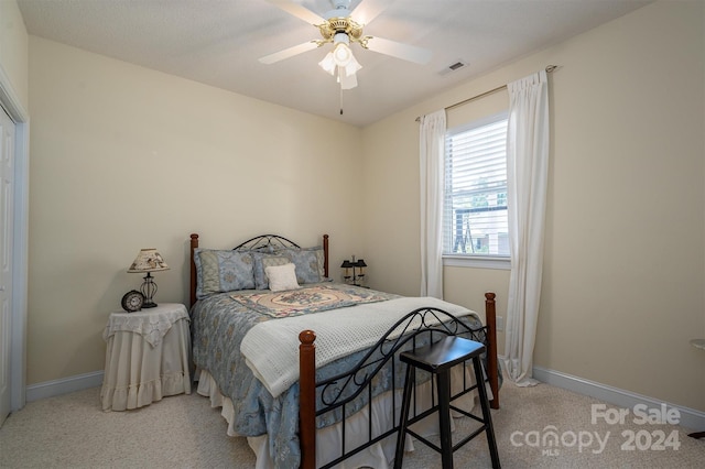 carpeted bedroom featuring ceiling fan