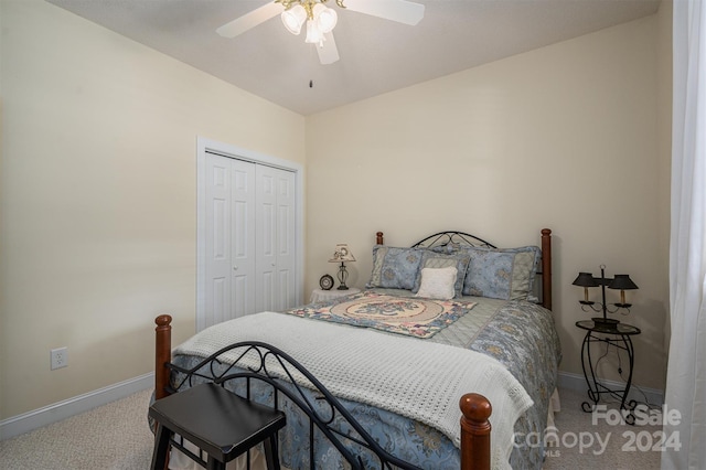 carpeted bedroom featuring a closet and ceiling fan