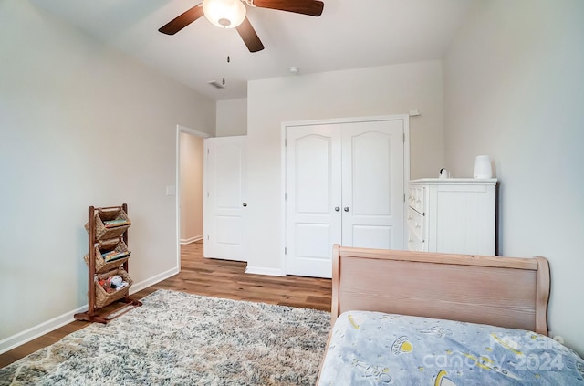 bedroom featuring a closet, ceiling fan, and hardwood / wood-style flooring