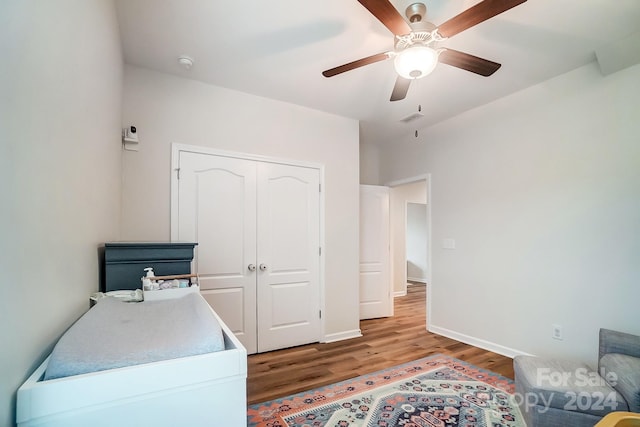 bedroom with a closet, ceiling fan, and hardwood / wood-style flooring