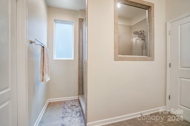 interior space featuring walk in shower and tile patterned flooring