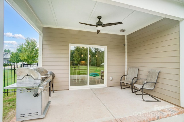 view of patio featuring area for grilling and ceiling fan