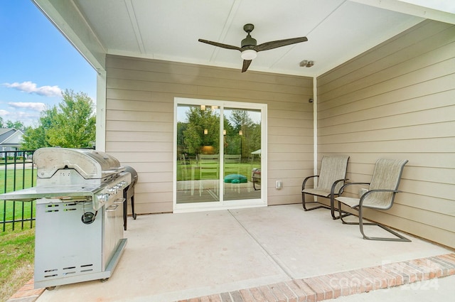 view of patio / terrace featuring ceiling fan and a grill