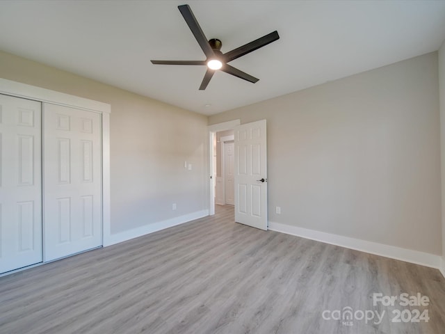 40 Ridgecrest Ave, Peachland, NC 28133 - unfurnished bedroom featuring light wood-style floors, a closet, and a ceiling fan