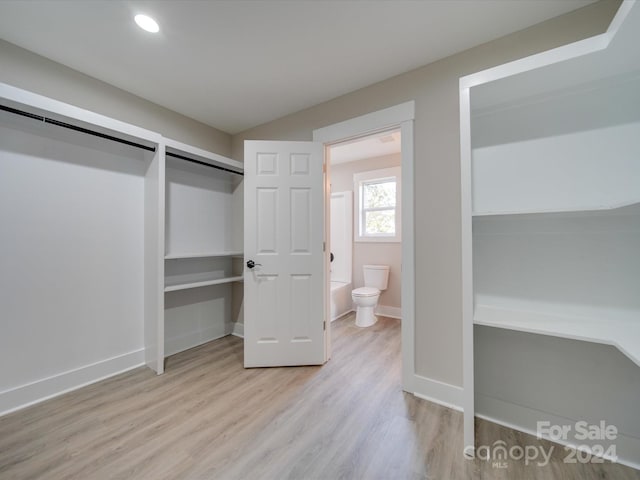 40 Ridgecrest Ave, Peachland, NC 28133 - unfurnished bedroom with light wood-style floors, two closets, and recessed lighting