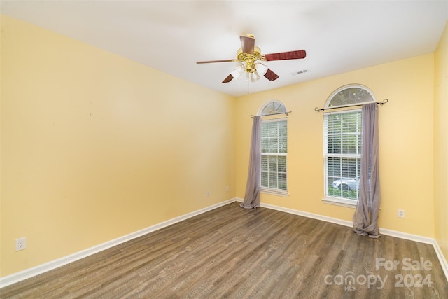 unfurnished room with hardwood / wood-style floors and ceiling fan