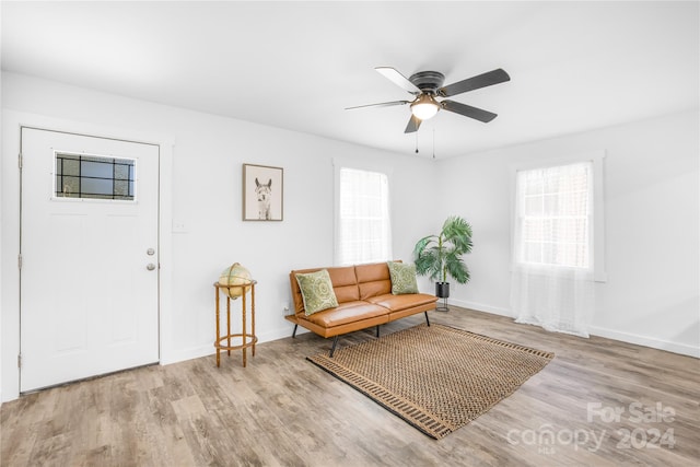 sitting room featuring light wood-type flooring and ceiling fan