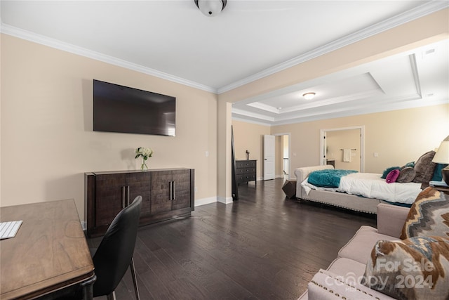 bedroom with ornamental molding, a raised ceiling, and dark hardwood / wood-style floors