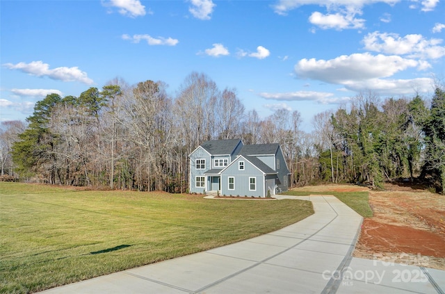 view of property featuring a front lawn