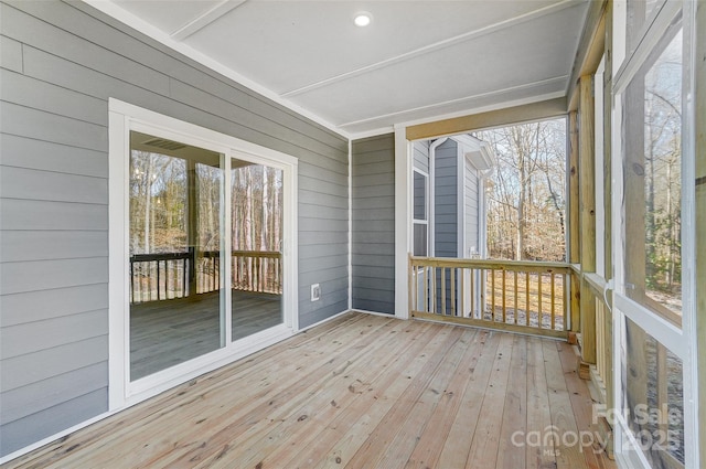 unfurnished sunroom featuring a wealth of natural light