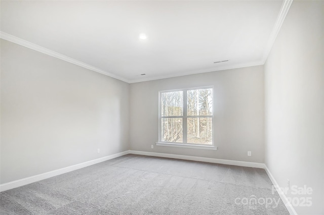 empty room with light colored carpet and ornamental molding