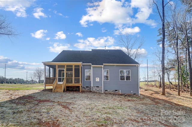 back of house featuring a sunroom