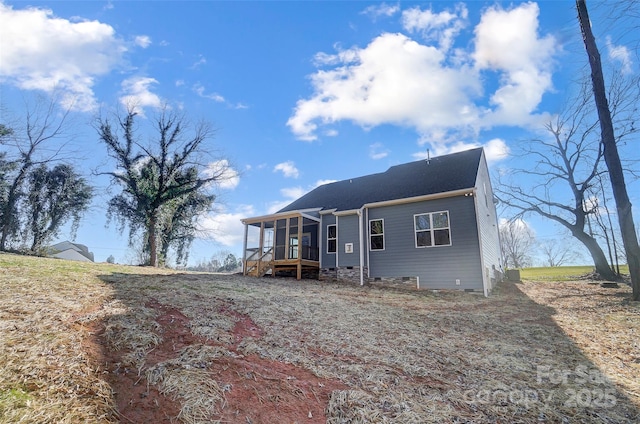 view of front of property featuring a sunroom