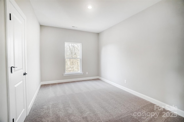 spare room featuring carpet floors