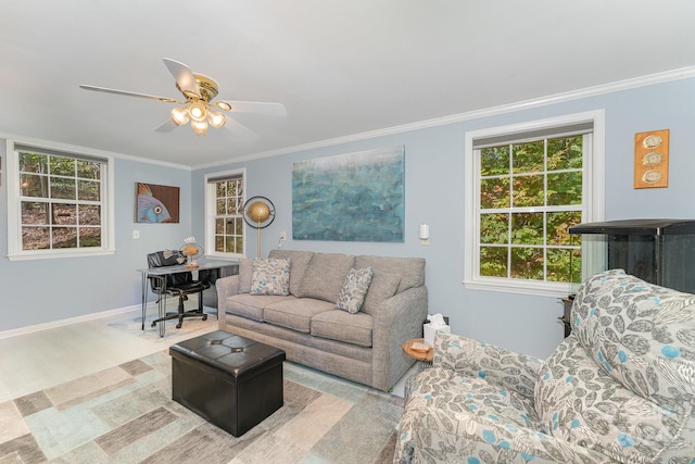 living room with ceiling fan and ornamental molding