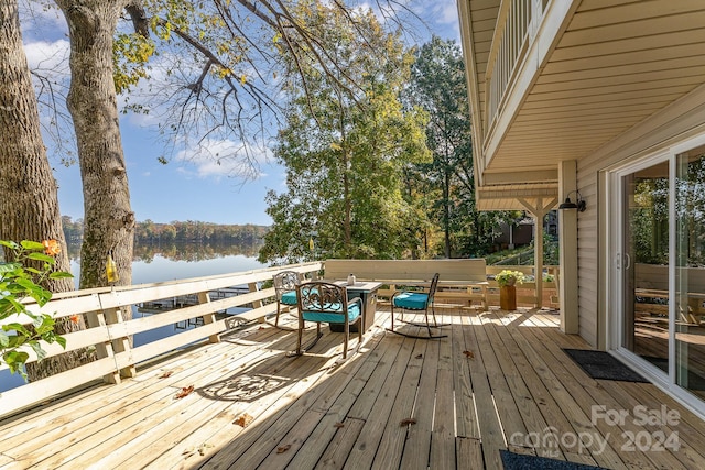 wooden terrace with a water view