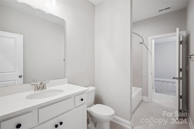 full bathroom with vanity, toilet, tile patterned floors, and shower / bathtub combination