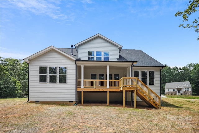 rear view of property featuring stairway, roof with shingles, crawl space, a yard, and a wooden deck