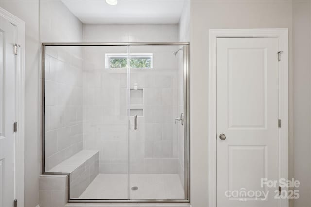 full bathroom featuring a shower stall