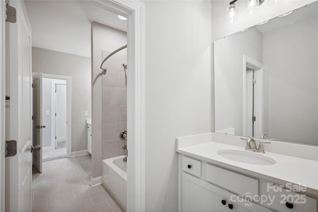 full bath with shower / washtub combination, tile patterned flooring, vanity, and baseboards