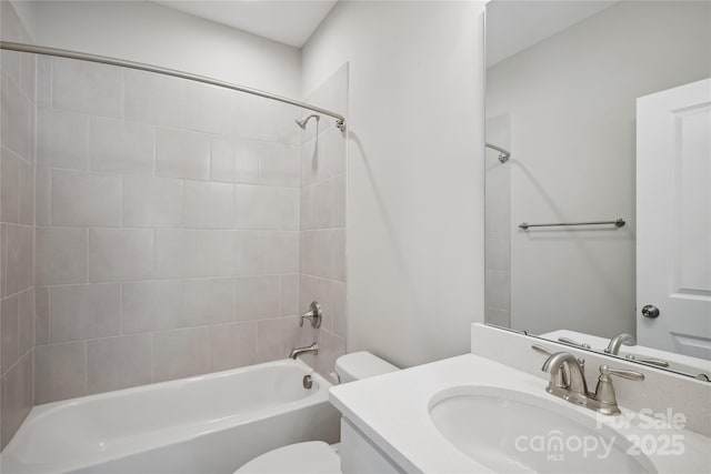 full bathroom featuring  shower combination, vanity, and toilet