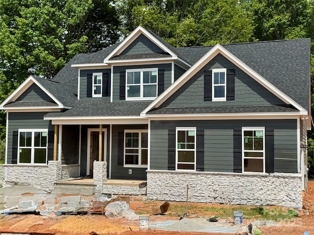 552 Fern Hill Rd Unit 21, Mooresville, NC 28117 - craftsman-style home featuring stone siding, covered porch, and roof with shingles