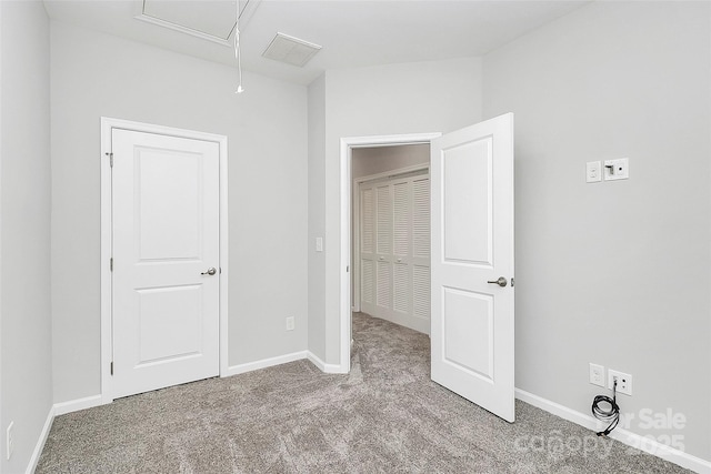 unfurnished bedroom with light carpet