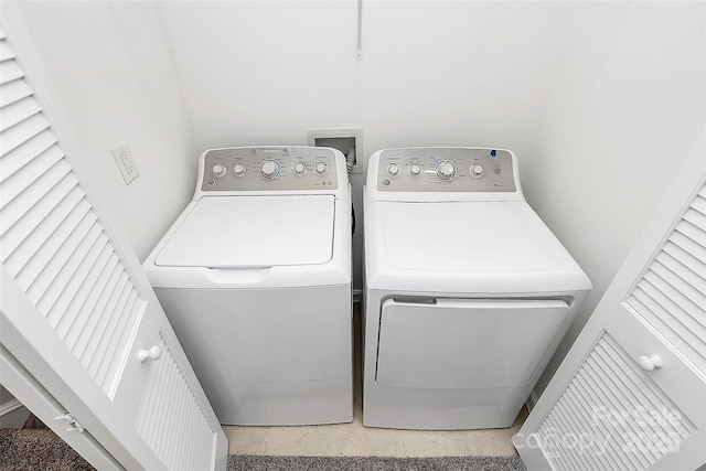 washroom with separate washer and dryer