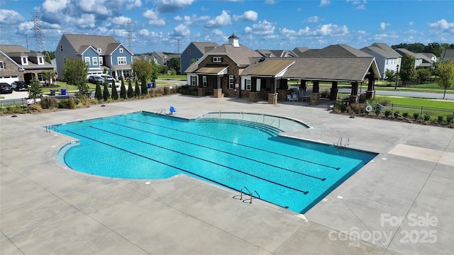 view of swimming pool with a patio