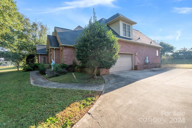 view of property exterior with roof with shingles, a lawn, a garage, brick siding, and concrete driveway