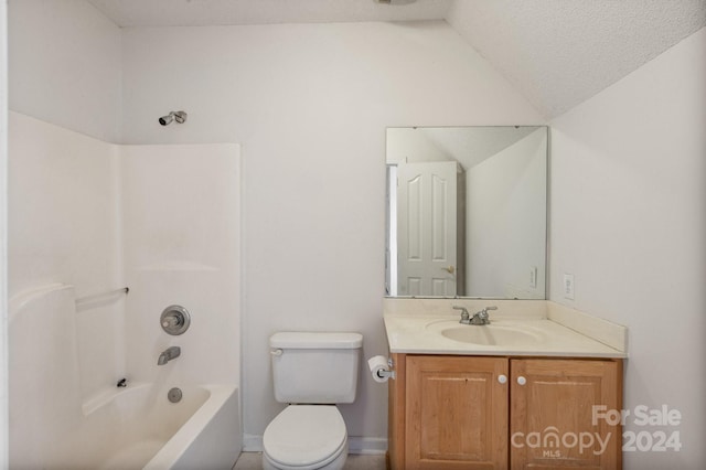 full bath featuring bathtub / shower combination, vanity, toilet, baseboards, and vaulted ceiling
