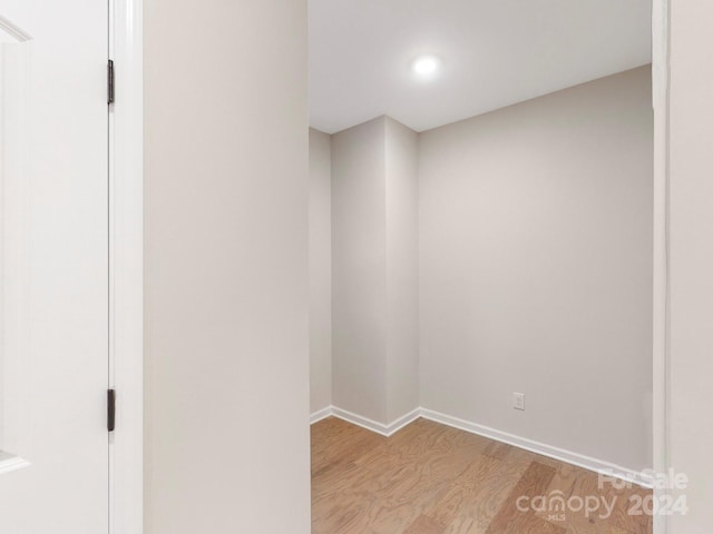 unfurnished room with light wood-type flooring