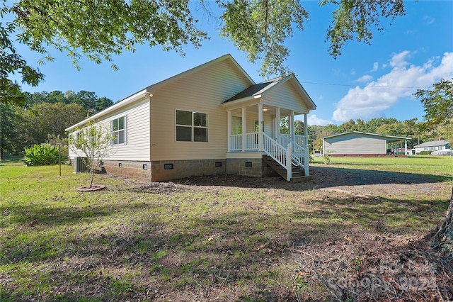 view of front of property with a porch and a front yard