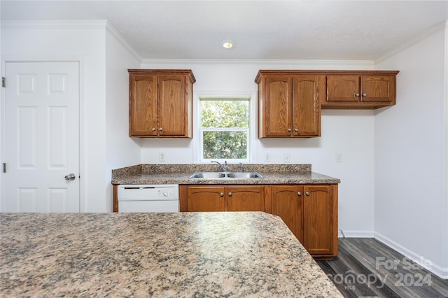 kitchen with ornamental molding, dishwasher, dark wood-type flooring, and sink