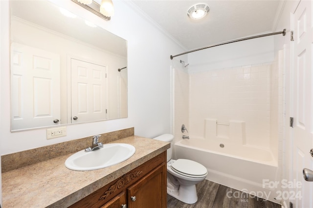 full bathroom with shower / bath combination, hardwood / wood-style floors, ornamental molding, vanity, and toilet