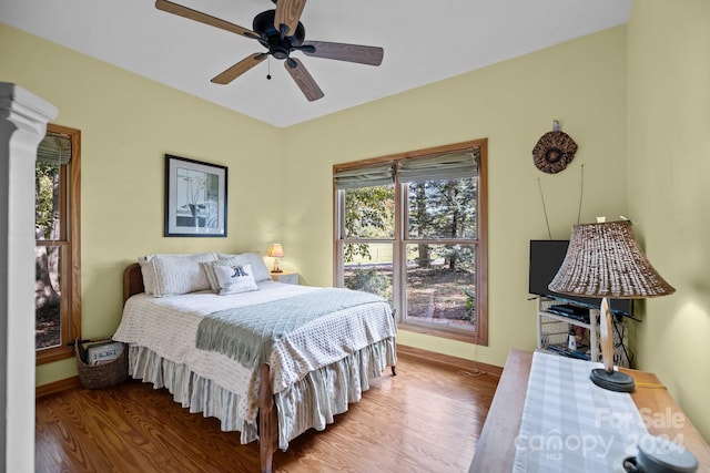 bedroom featuring hardwood / wood-style flooring and ceiling fan