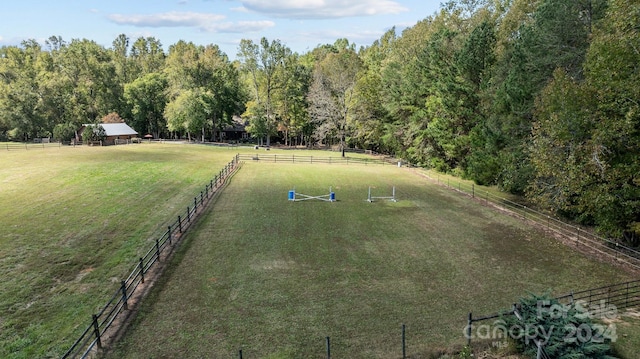 view of yard with a rural view