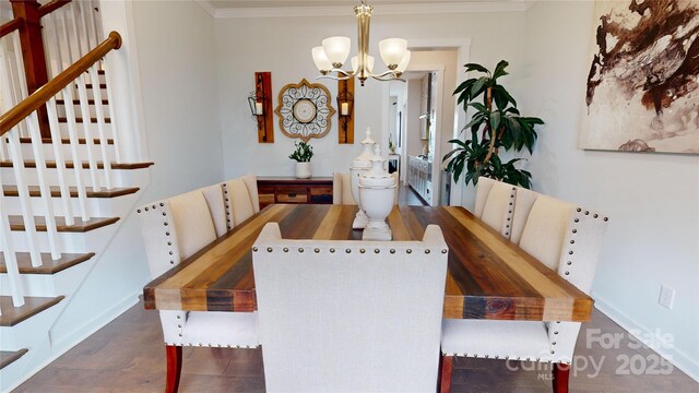 dining room featuring dark hardwood / wood-style flooring, crown molding, and a notable chandelier