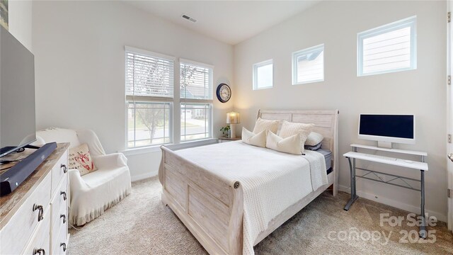 bedroom featuring light carpet