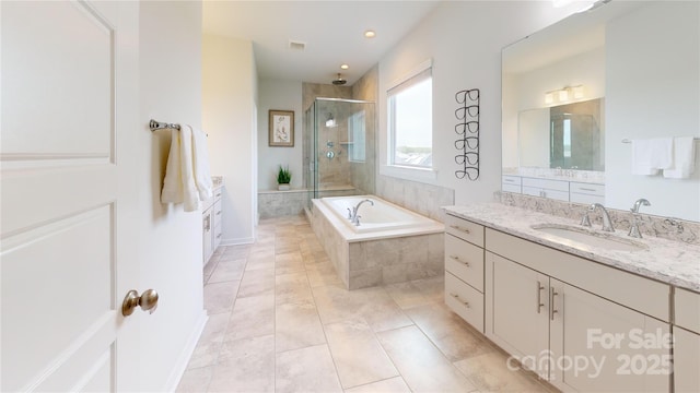 bathroom with separate shower and tub, tile patterned floors, and vanity