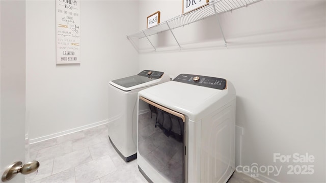 laundry area featuring separate washer and dryer