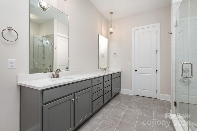 bathroom featuring vanity, tile patterned floors, and an enclosed shower