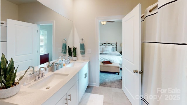 bathroom featuring tile patterned floors and vanity