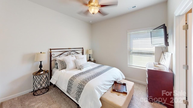 bedroom with ceiling fan and carpet