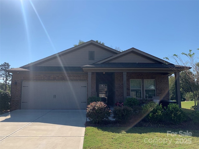 single story home featuring a front lawn and a garage