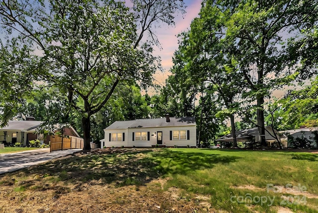 view of front of house with a lawn