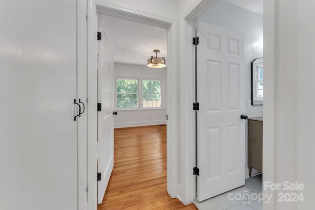 hall with light hardwood / wood-style floors