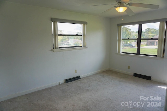 carpeted empty room with ceiling fan