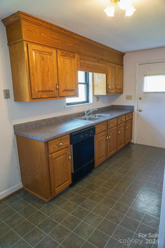 kitchen featuring black dishwasher, a healthy amount of sunlight, and sink