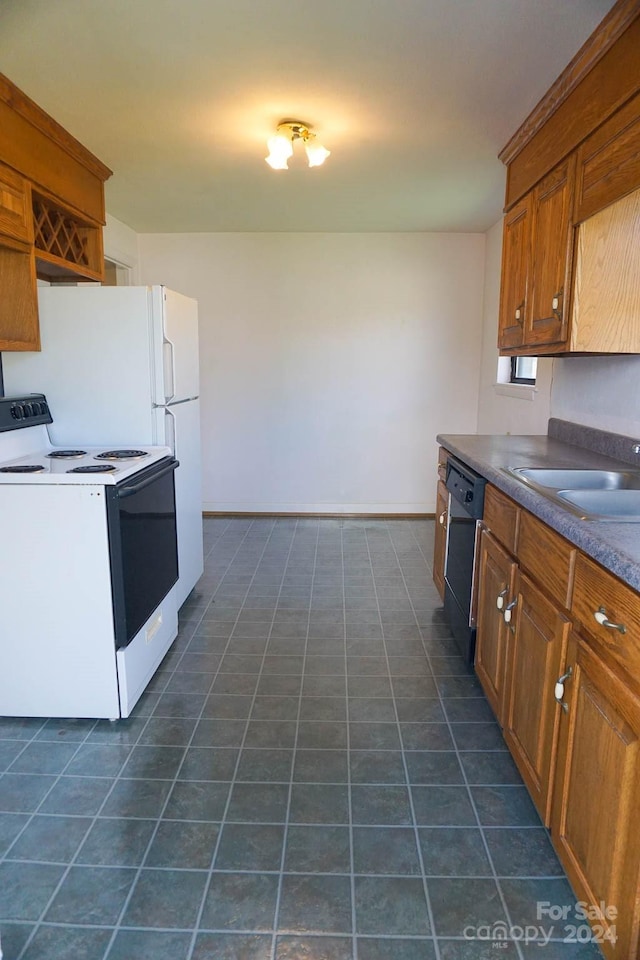 kitchen with dark tile patterned floors, black dishwasher, electric range, and sink